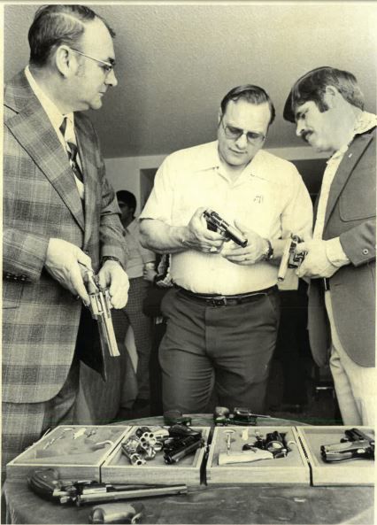 Helena Police Chief Jack Williams, left, and Larry Anderson, center